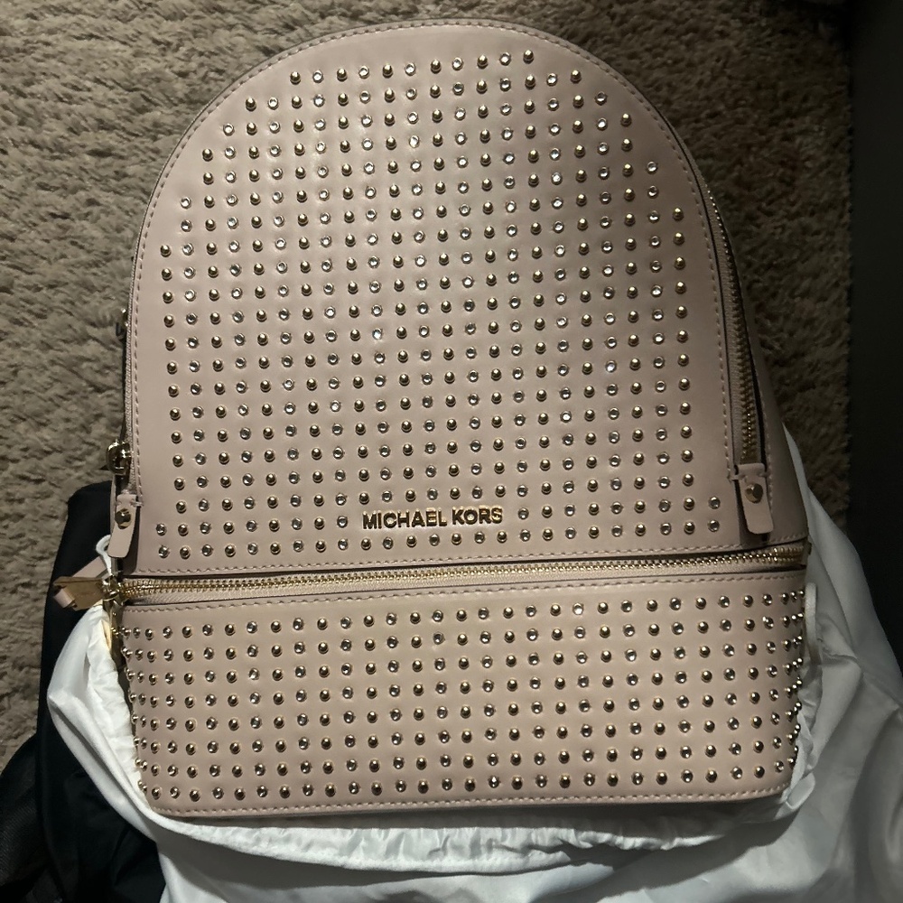 Pink studded Michael kors mini backpack